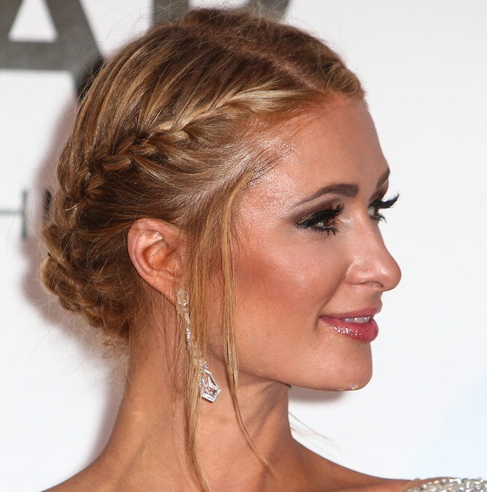 Paris Hilton braids her hair for the 2016 amfAR Cinema Against AIDS Gala