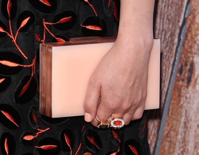 Rose Byrne carried a peach Rauwolf clutch and wore rings from Irene Neuwirth