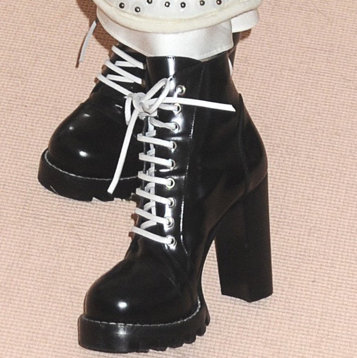 Selena Gomez in lace-up Louis Vuitton combat boots