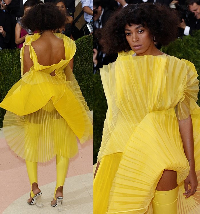 Solange Knowles in Loewe PVC Heels and Yellow Fan Pleated Dress