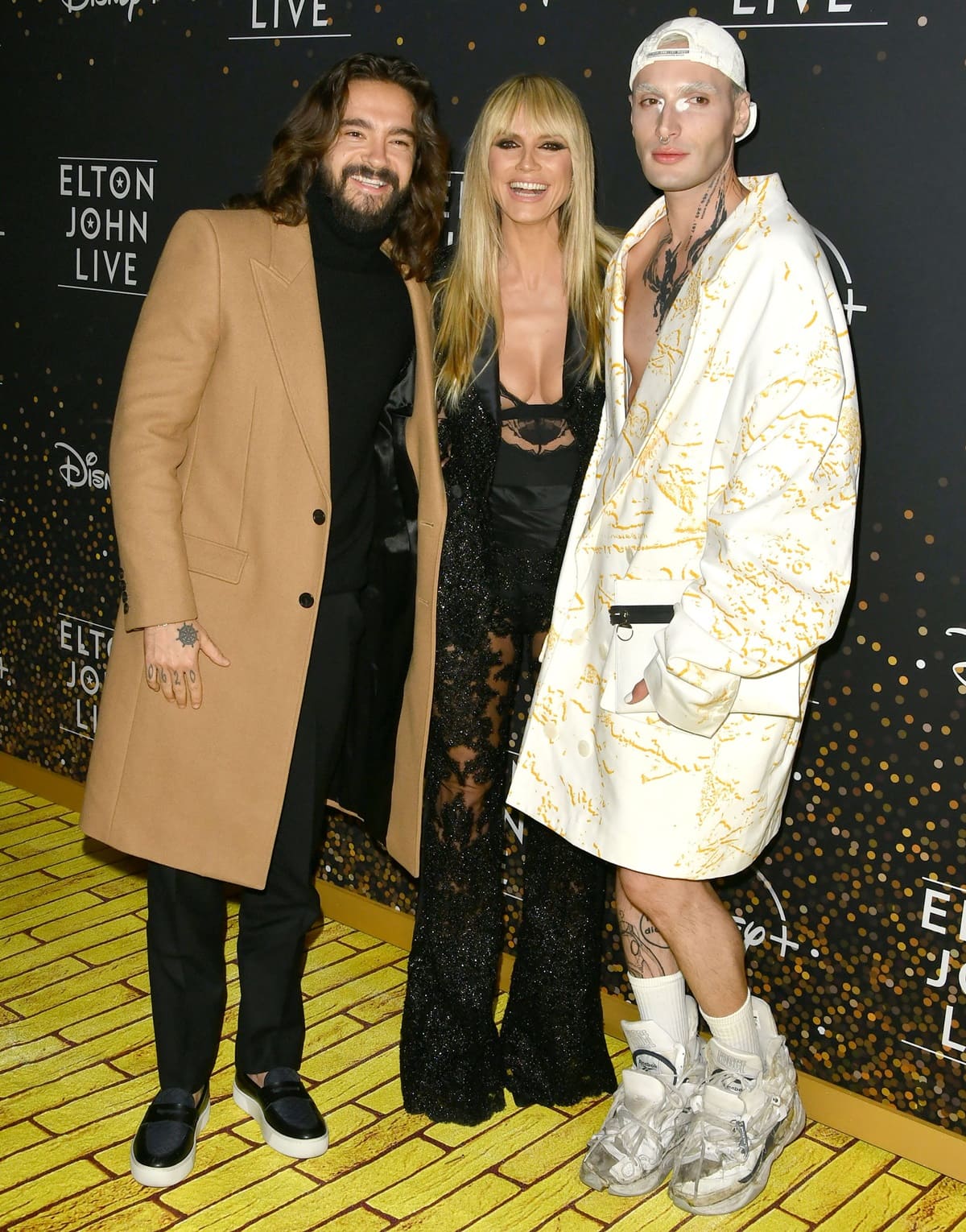 Tom Kaulitz, Yannik Zamboni, and Heidi Klum at the Disney+ "Elton John Live: Farewell From Dodger Stadium" Yellow Brick Road Event