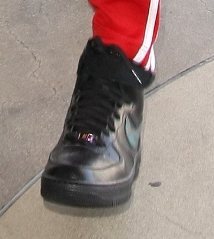Bella Hadid strolls through LAX in Nike high-top sneakers
