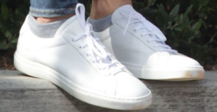Alessandra slips into a comfortable Achilles sneaker pair from Common Projects