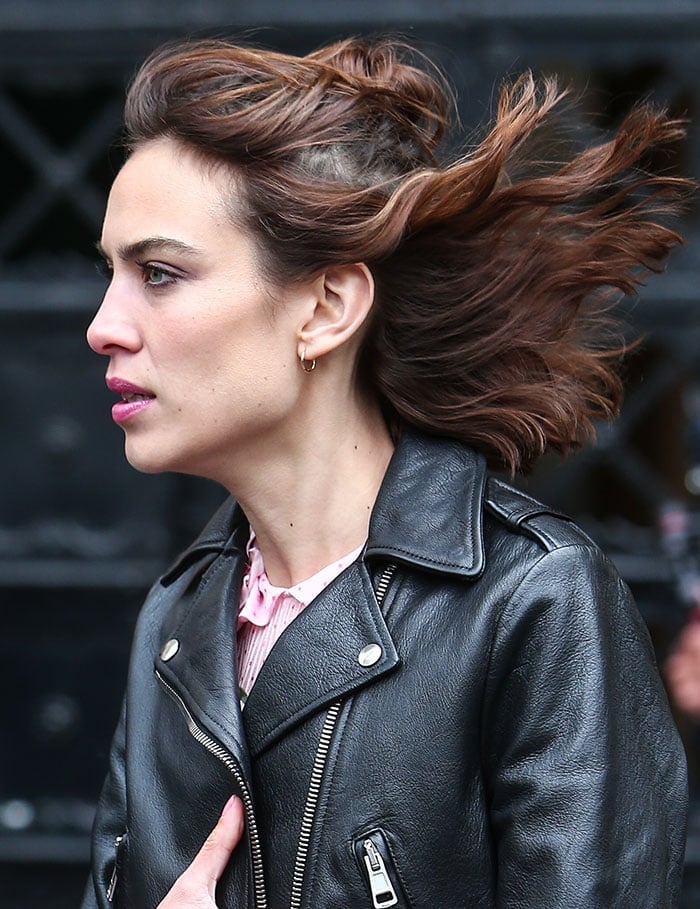 Alexa Chung lets her hair flow in the wind at the Gucci catwalk show