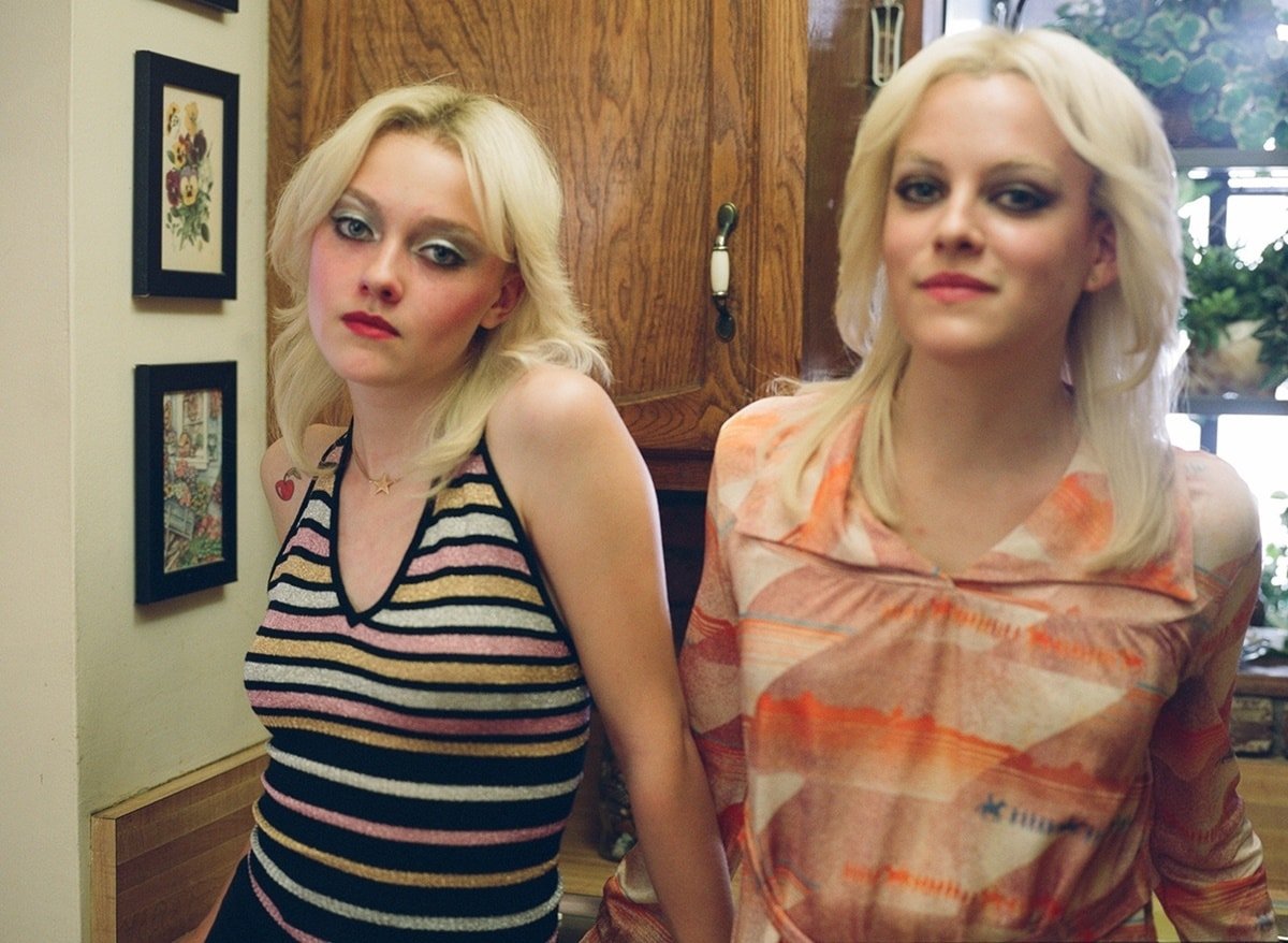 Dakota Fanning as Cherie Currie and Kristen Stewart as Joan Jett in the 2010 American biographical drama film The Runaways