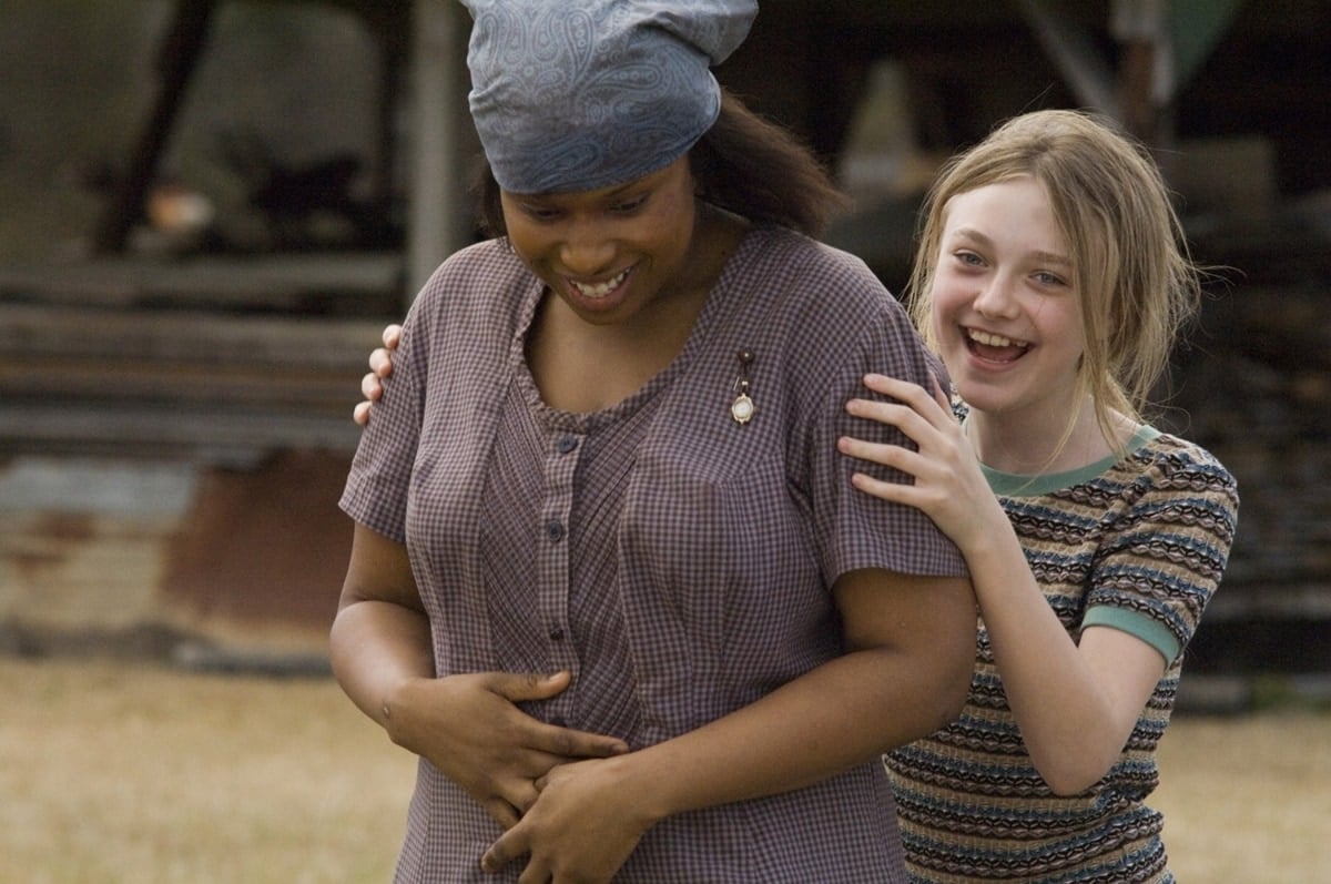 Dakota Fanning as Lily Owens and Jennifer Hudson as Rosaleen "July" Daise-Boatwright in the 2008 American drama film The Secret Life of Bees