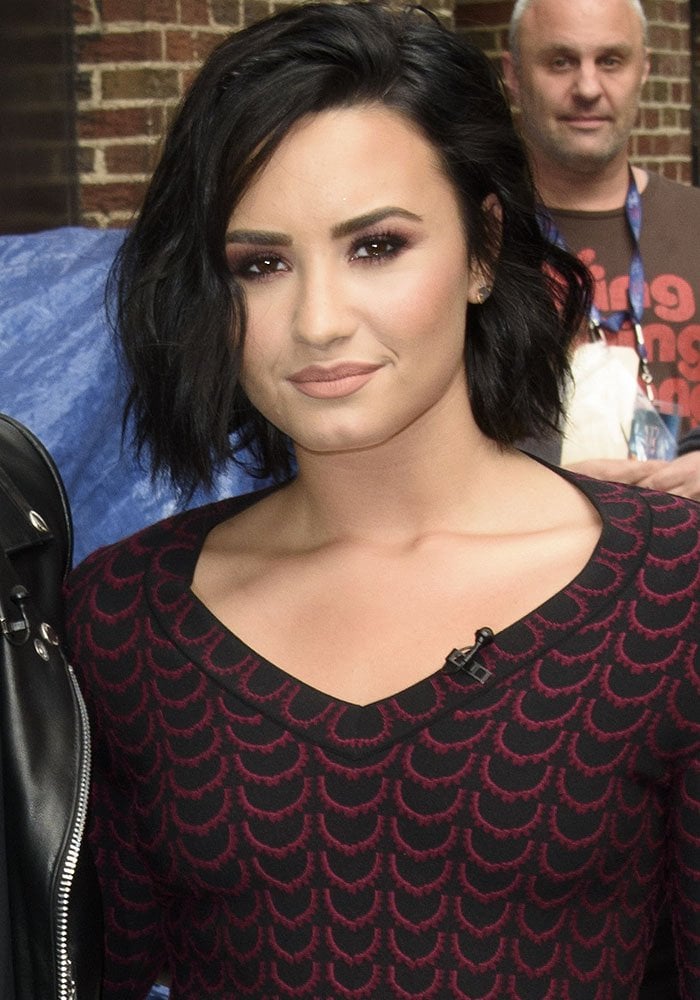 Demi Lovato wears her hair down for an appearance on "The Late Night With Stephen Colbert"