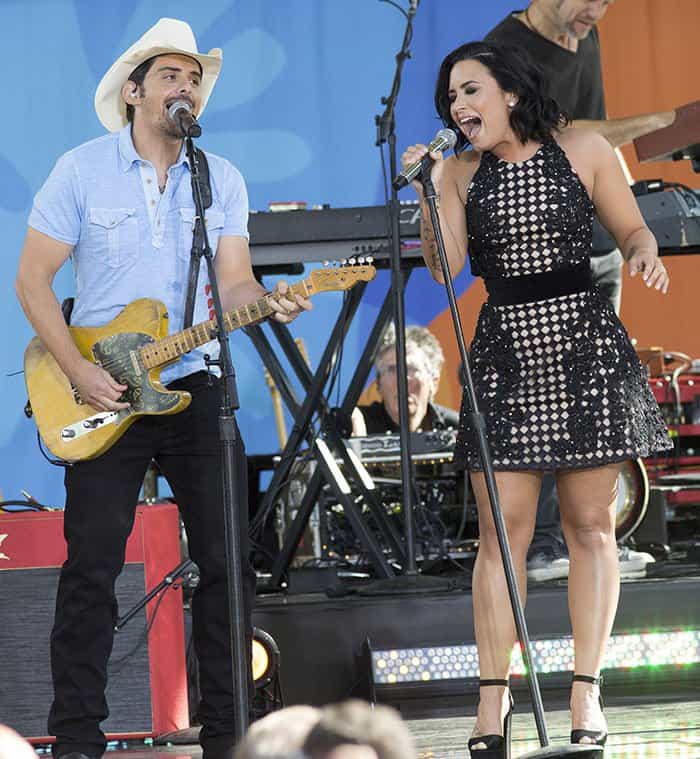 Demi Lovato shared the stage with country singer Brad Paisley on the set of Good Morning America, leaving the audience awe-struck by her commanding vocals while Brad's skillful guitar accompaniment resonated in harmony