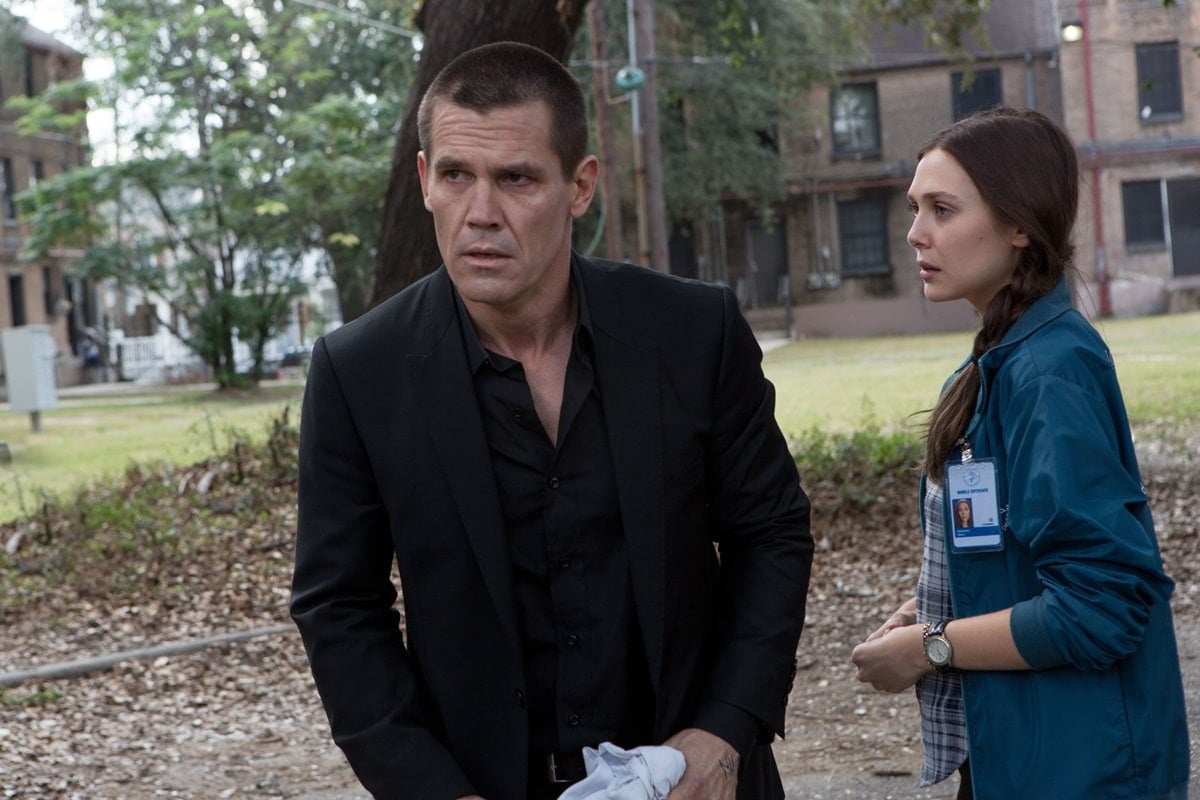 Josh Brolin as Joe Doucett and Elizabeth Olsen as Marie Sebastian in the 2013 American neo-noir action thriller film Oldboy