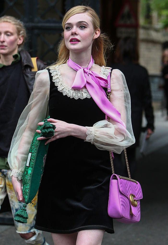 Elle Fanning wears a gothic-chic Gucci ensemble to the label's Westminster Abbey fashion show