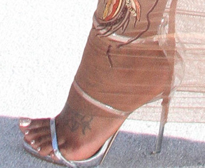 Fantasia Barrino's feet and foot tattoos in silver Giuseppe Zanotti sandals