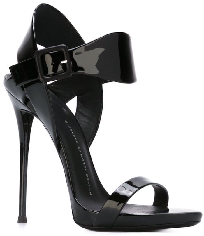 Black patent leather ‘Cassie’ sandals from Giuseppe Zanotti featuring an open toe, a side buckle fastening, a branded insole, and a high stiletto heel