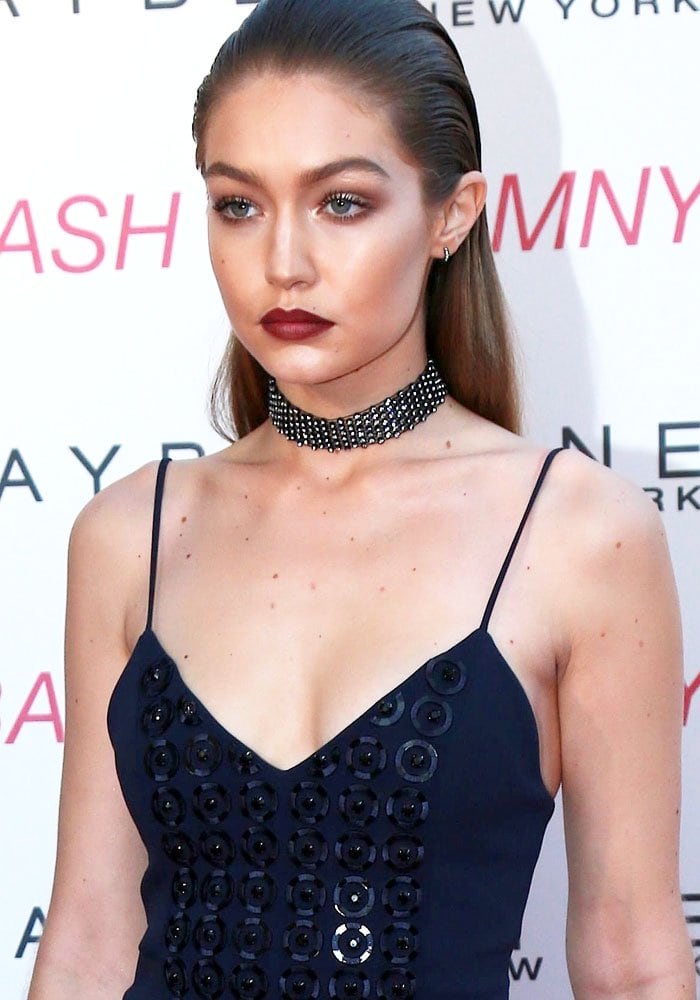 Gigi Hadid slicks her hair back as she hosts the Maybelline New York Beauty Bash