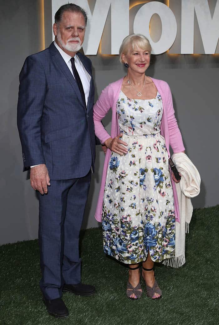 Helen Mirren looks radiant in a floral tea-length dress paired with a pink cardigan, joined by her husband Taylor Hackford at the 2016 Museum of Modern Art Garden Party