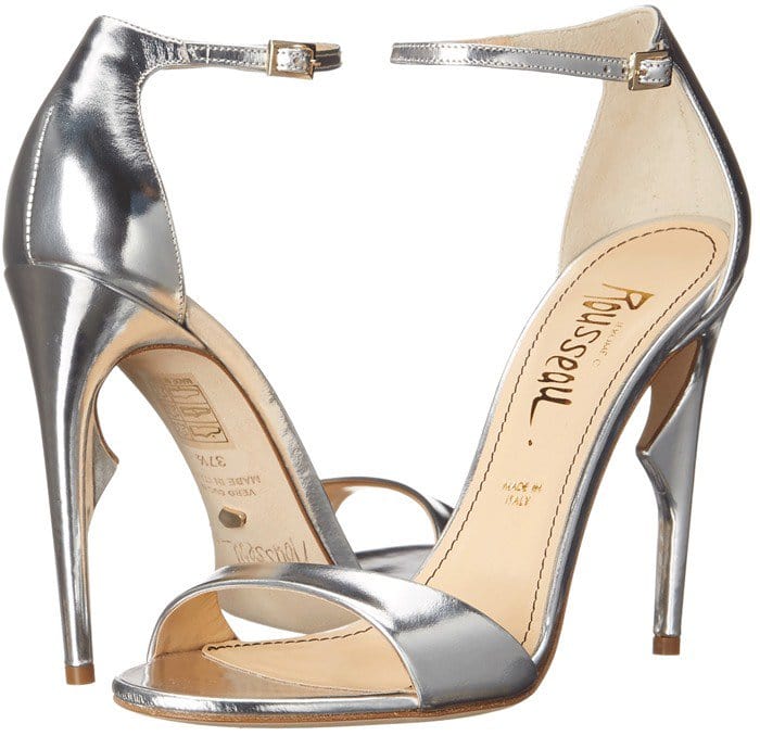 These silver leather sandals feature buckled ankle straps, open toes, and about four-inch sculpted heels