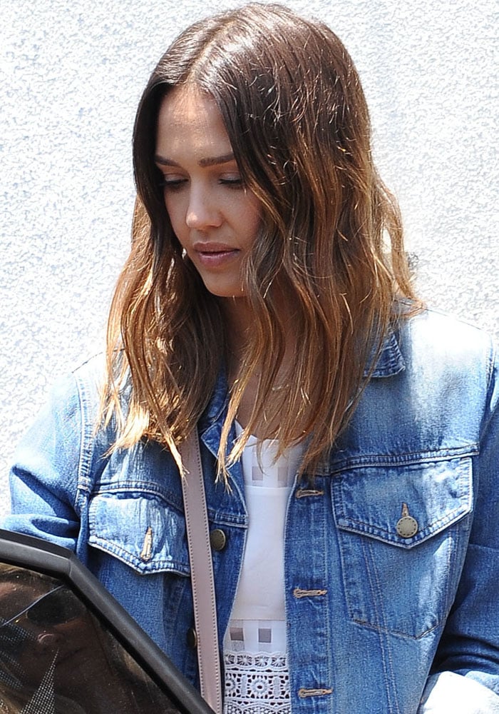 Jessica Alba wore a denim jacket with a Lovers + Friends Maddie top