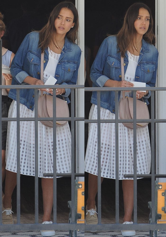 Jessica Alba styled her Robert Clergerie "Teba" raffia sneakers with a breezy white checkered skirt, relaxed tank top, and classic denim jacket for a fresh, laid-back summer look