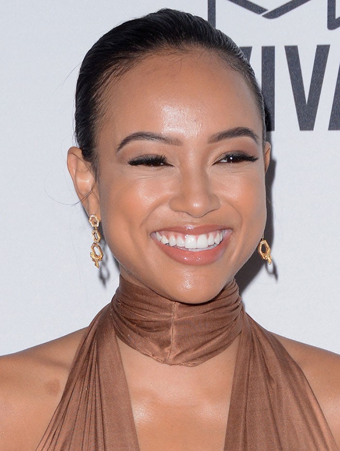 Karrueche Tran slicks her hair back at the 7th annual amfAR Inspiration Gala