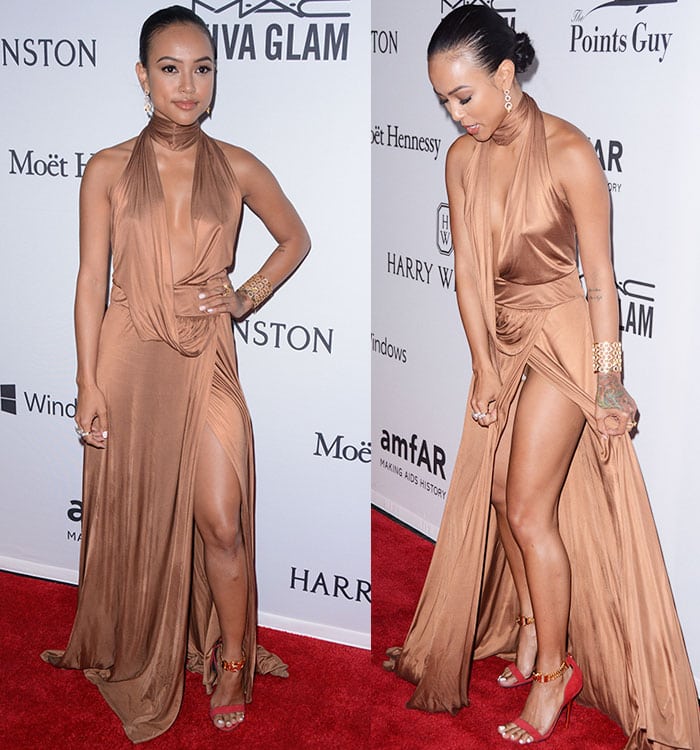 Karrueche Tran accidentally flashes her underwear as she adjusts her Tom Ford for Gucci dress on the red carpet of the amfAR Inspiration Gala