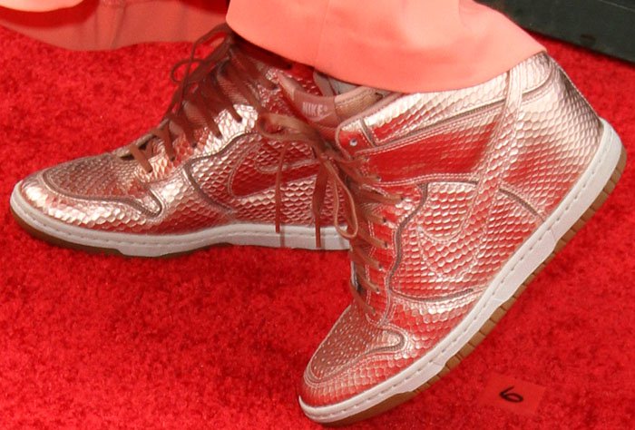 Katie switches out her heels for a pair of Nike "Dunk Sky Hi" wedge sneakers