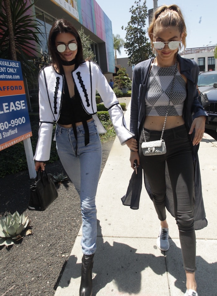 Kendall Jenner wears an Andrew GN jacket while out to lunch with best friend Gigi Hadid
