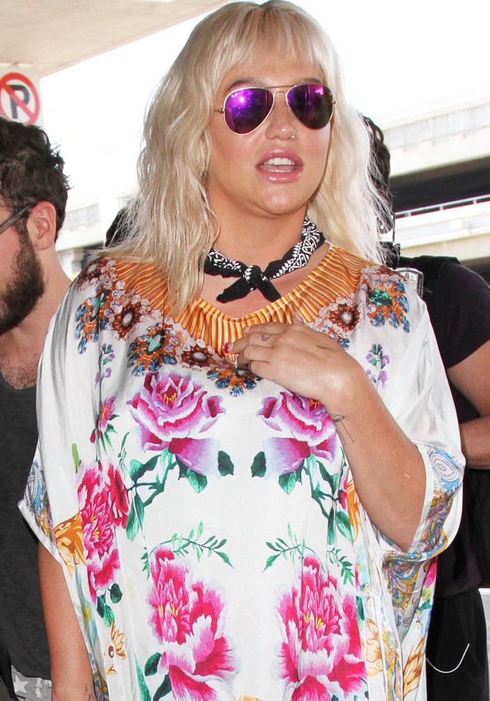 Kesha departs from the Los Angeles Airport (LAX) in a loose floral dress