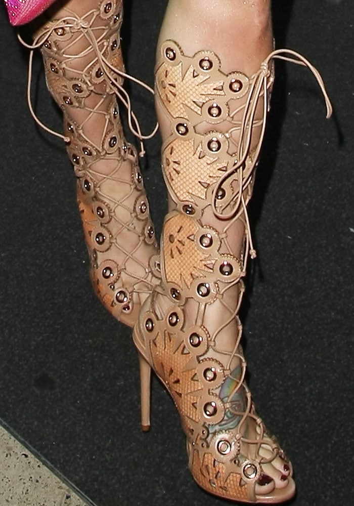 Kesha shows off her feet in a head-turning pair of Ivy Kirzhner "Cannes" gladiator sandals