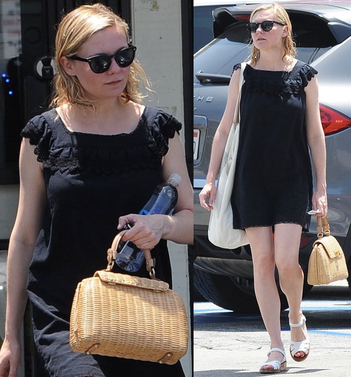 Kirsten Dunst wears a black mini dress and carries a wicker Salvatore Ferragamo bag while out in Burbank