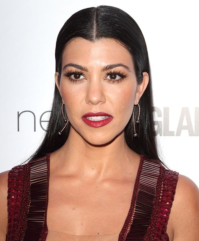 Kourtney Kardashian parts her slick hair down the center at the Glamour Women Of The Year Awards