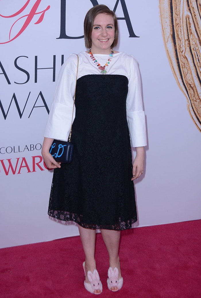 Lena Dunham wears a blouse and dress from Creatures of the Wind on the red carpet