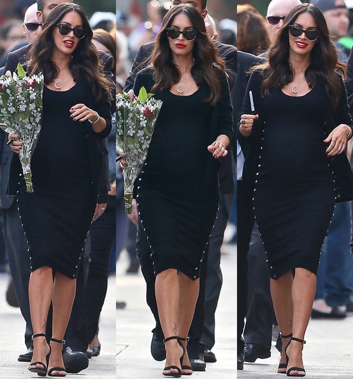 Megan Fox wearing her tresses down in loose waves and sporting a slick of red lipstick