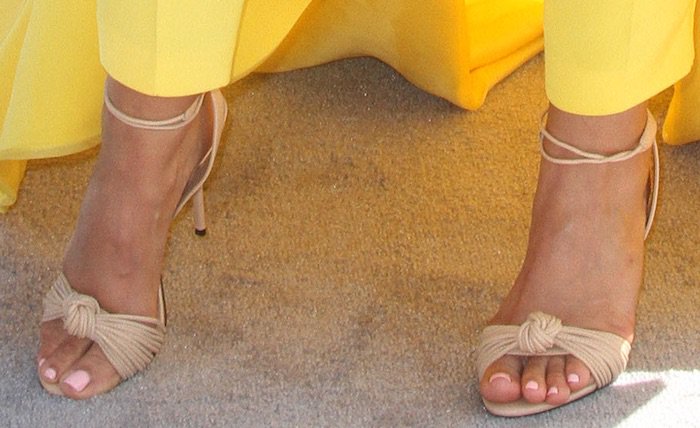 Mya displays her toes and feet in nude Aldo sandals