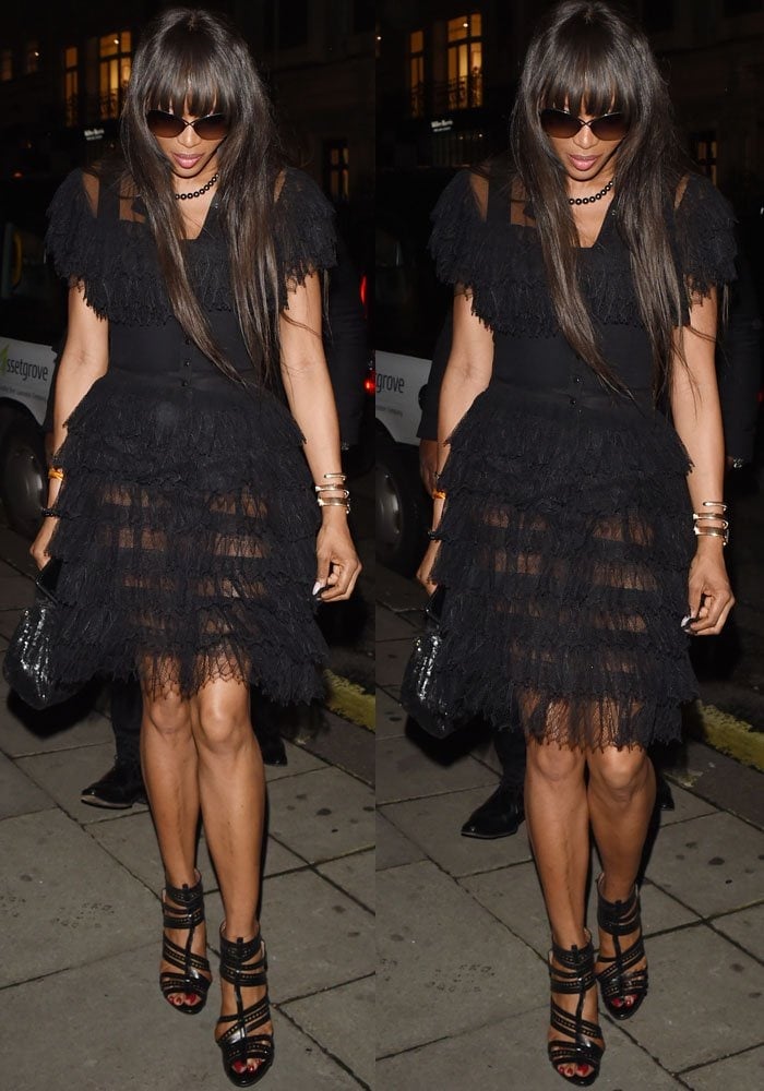 Naomi Campbell wears a black Alaïa dress while out to dinner in London