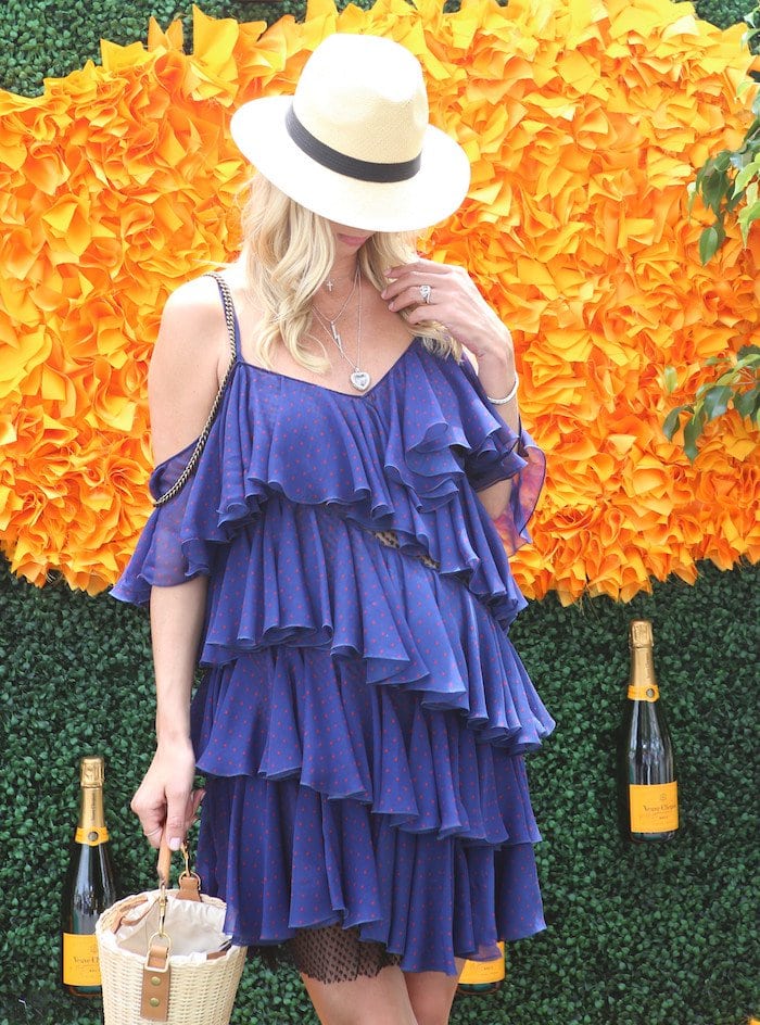 Nicky Hilton hides her growing baby bump in a ruffled blue Philosophy dress