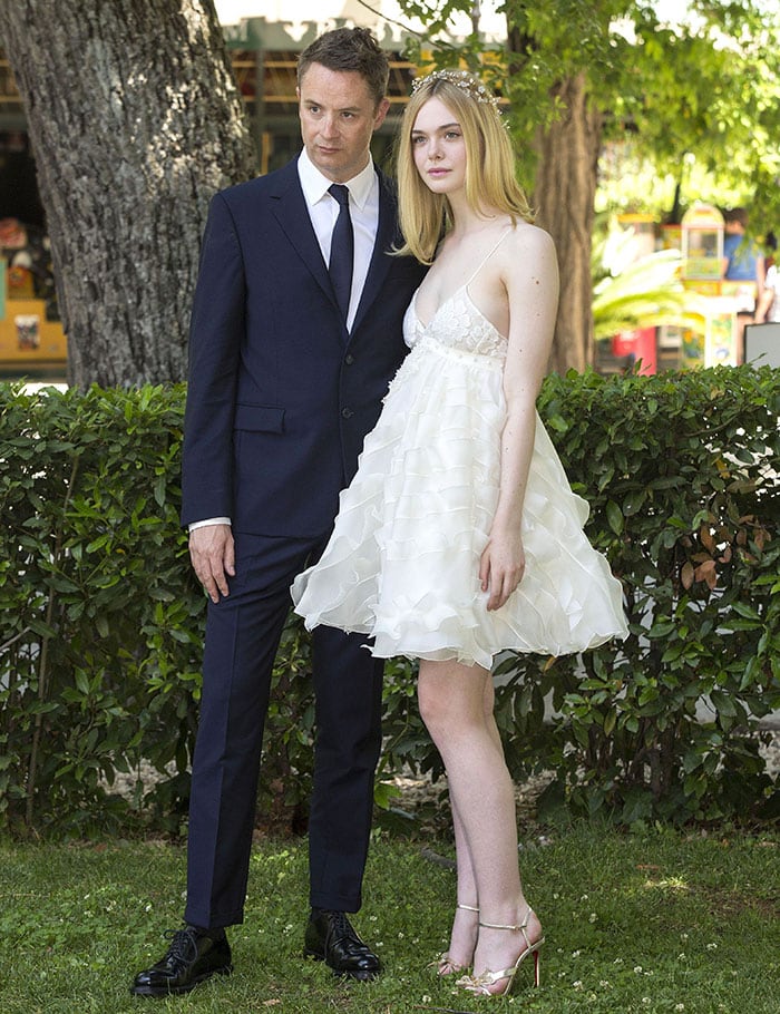 Nicolas Winding Refn and Elle Fanning pose for photos at the "The Neon Demon" photo call