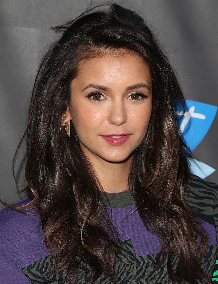 Nina Dobrev sports messy curls in her hair at Elle's Women In Comedy event
