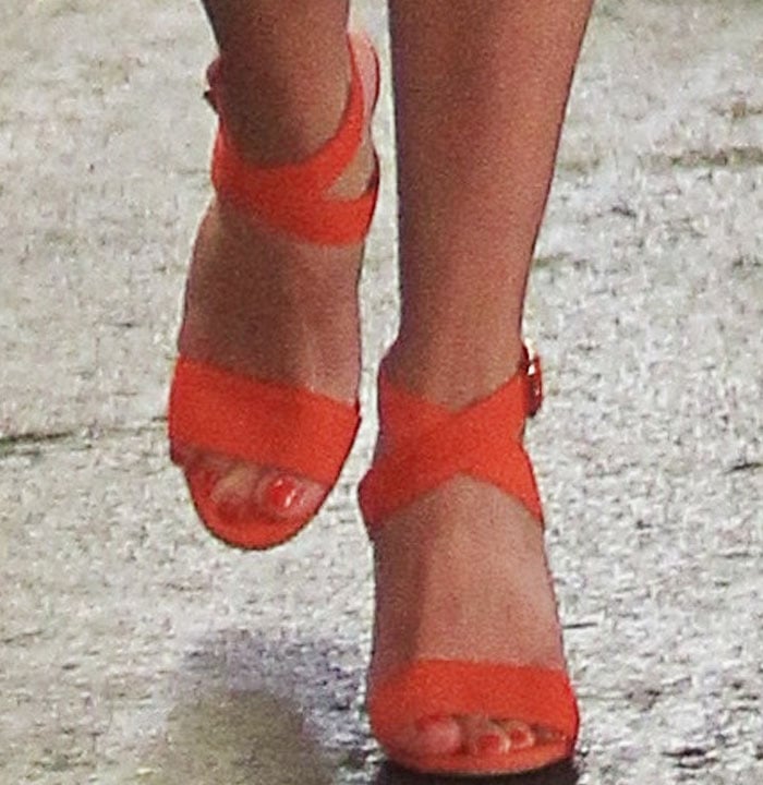 Reese Witherspoon's feet in orange Manolo Blahnik sandals