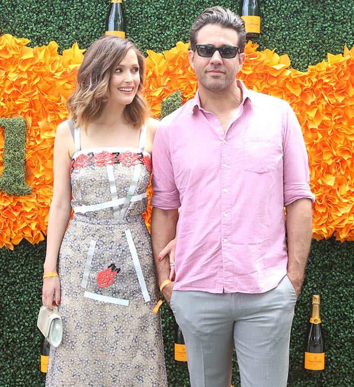 With a notable 8-inch height difference, Rose Byrne, at 5'6", looks up to her 6'2" partner, Bobby Cannavale, as they enjoy the Veuve Clicquot Polo Classic together