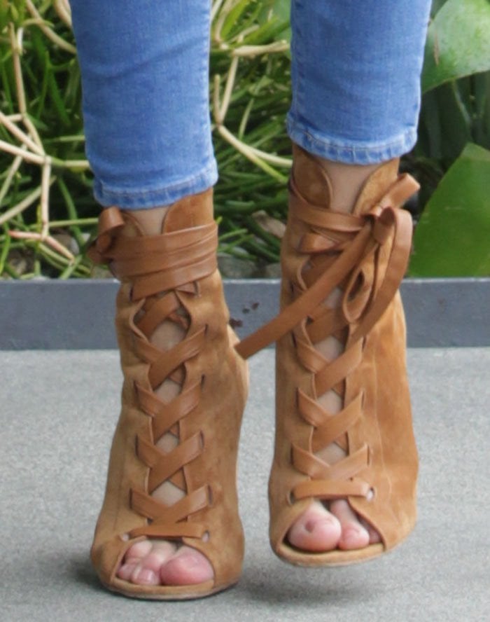 Rosie Huntington-Whiteley's feet in lace-up Gianvito Rossi booties