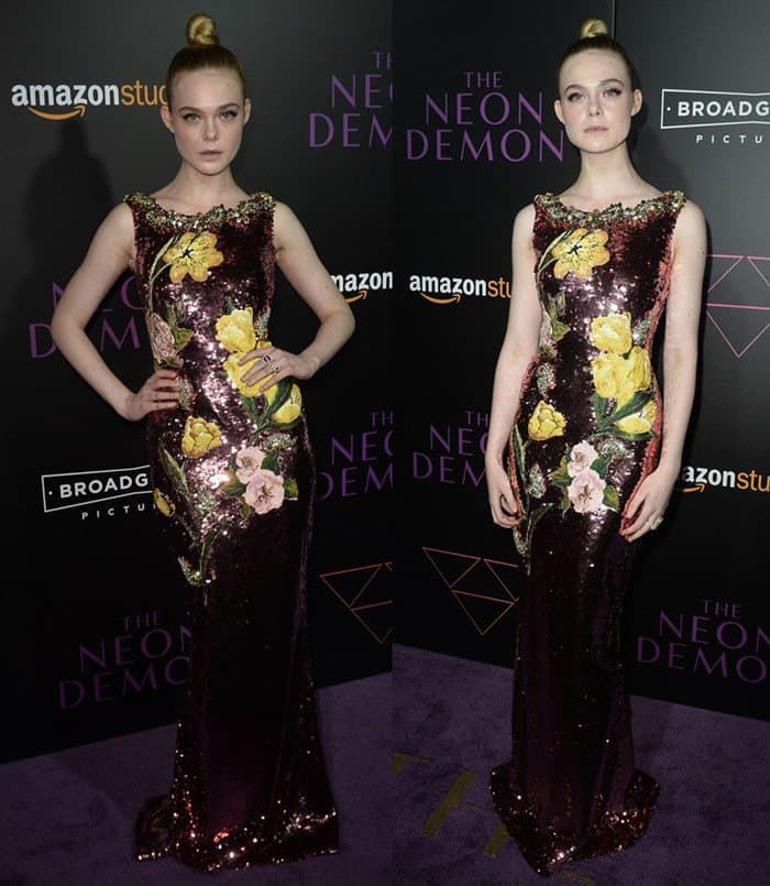 Elle Fanning stunned in a maroon sequin Dolce & Gabbana gown adorned with vibrant floral appliques, perfectly balancing elegance and youthfulness at The Neon Demon LA premiere