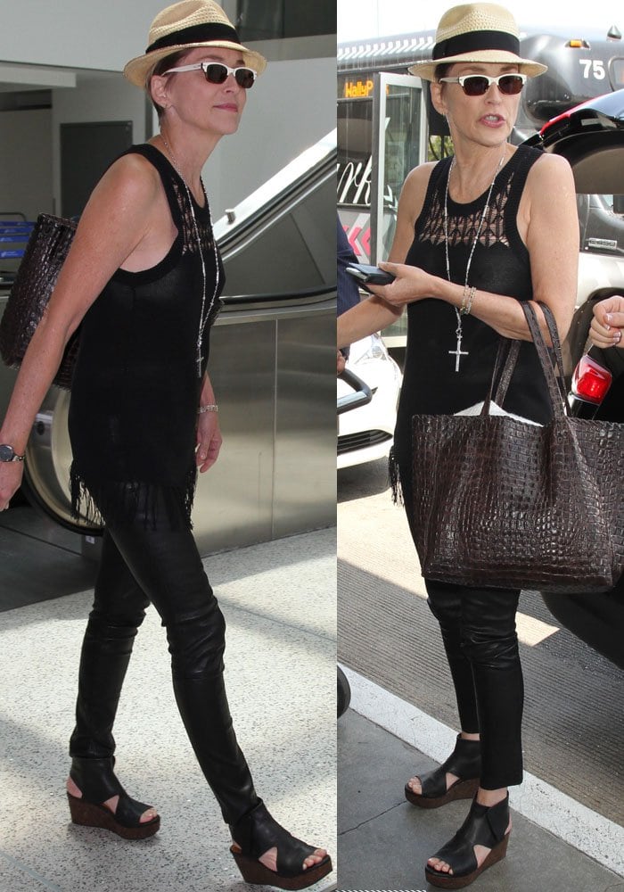 Sharon Stone shows off her assets in a pair of leather pants and a black knit top