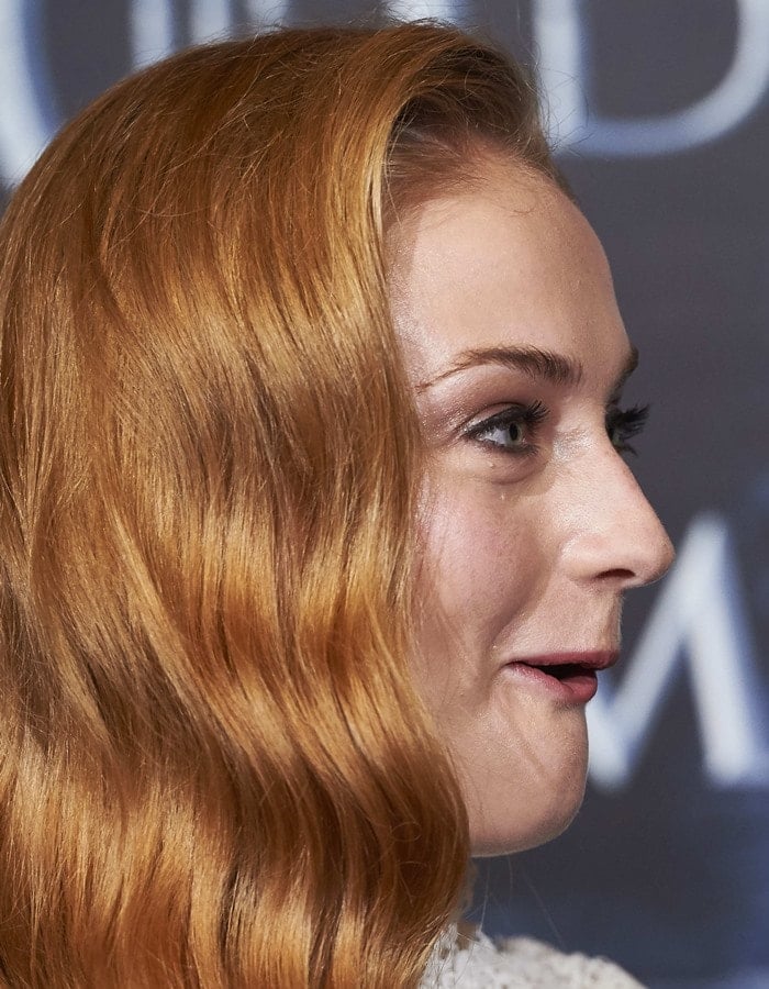 Sophie Turner curls her red hair for a "Game Of Thrones" fan event in Madrid
