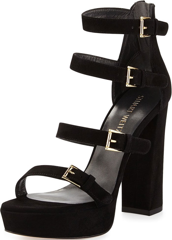 Black suede Stuart Weitzman Fourbucks sandals with gold-tone hardware featuring buckle accents at sides, tonal stitching throughout, covered platforms and block heels, and tonal zip closure at counters