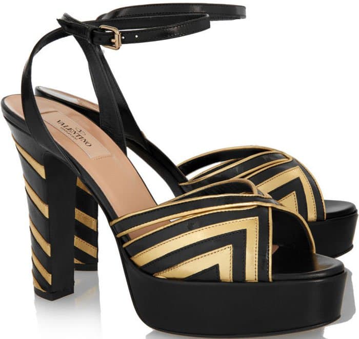 Inspired by retro styles, this pair is designed with a block heel, a sizable platform, and a peep-toe cutout