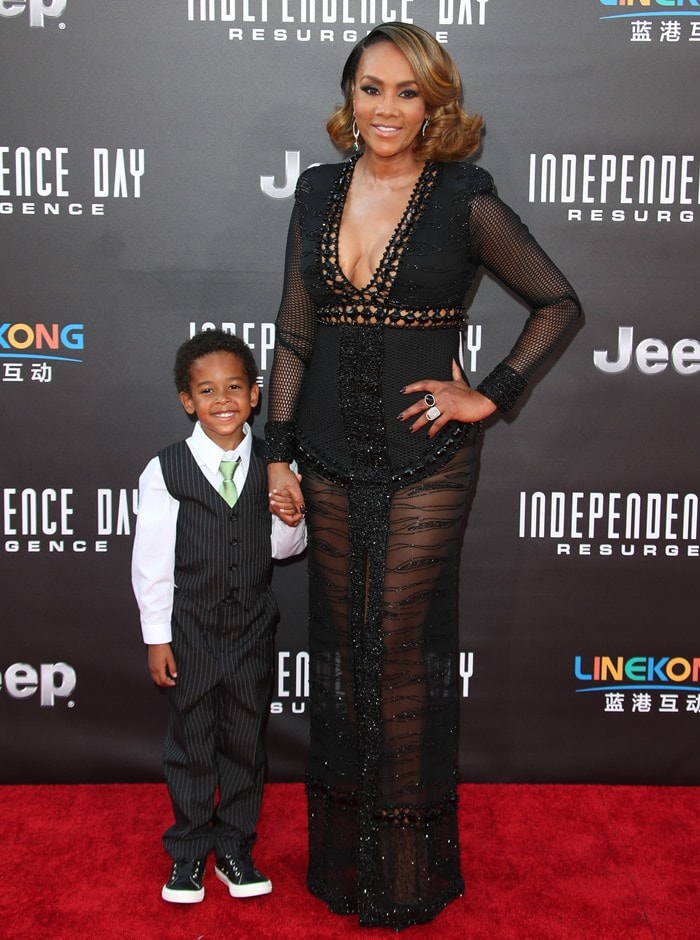 Vivica A. Fox, with her adorable godson, Christian Kelley, wears a custom Esé Azénabor dress on the red carpet