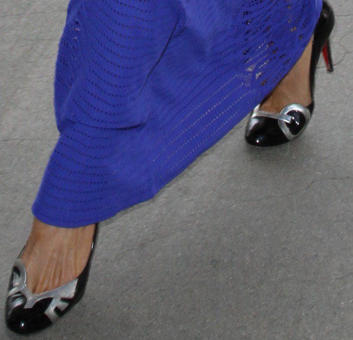 Paris Hilton's feet in black patent Christian Louboutin pumps