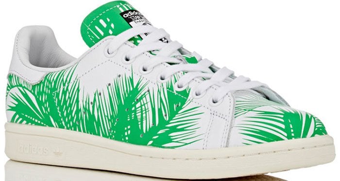 The shoe implements a vibrant design with an all-over palm tree pattern, while the BBC astronaut logo appears on the tongue