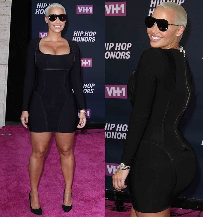 Amber Rose shows off her model figure in an ultra-tight long-sleeved black dress