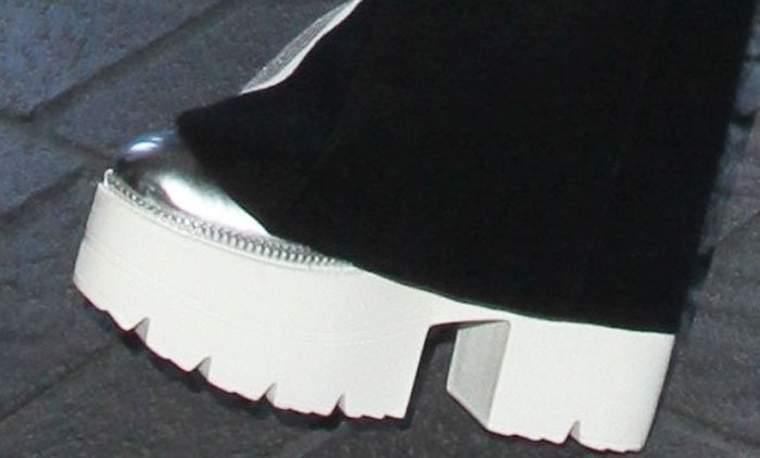 Bella Thorne wears a pair of silver platform heels as she strolls through LAX