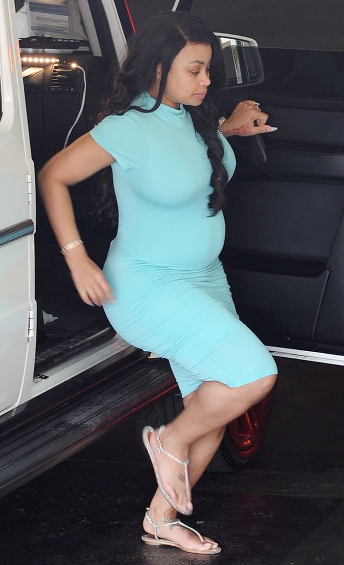 Blac Chyna shows off her baby bump in a tight green dress as she heads to Brazilian Honey Waxing in Beverly Hills on June 28, 2016